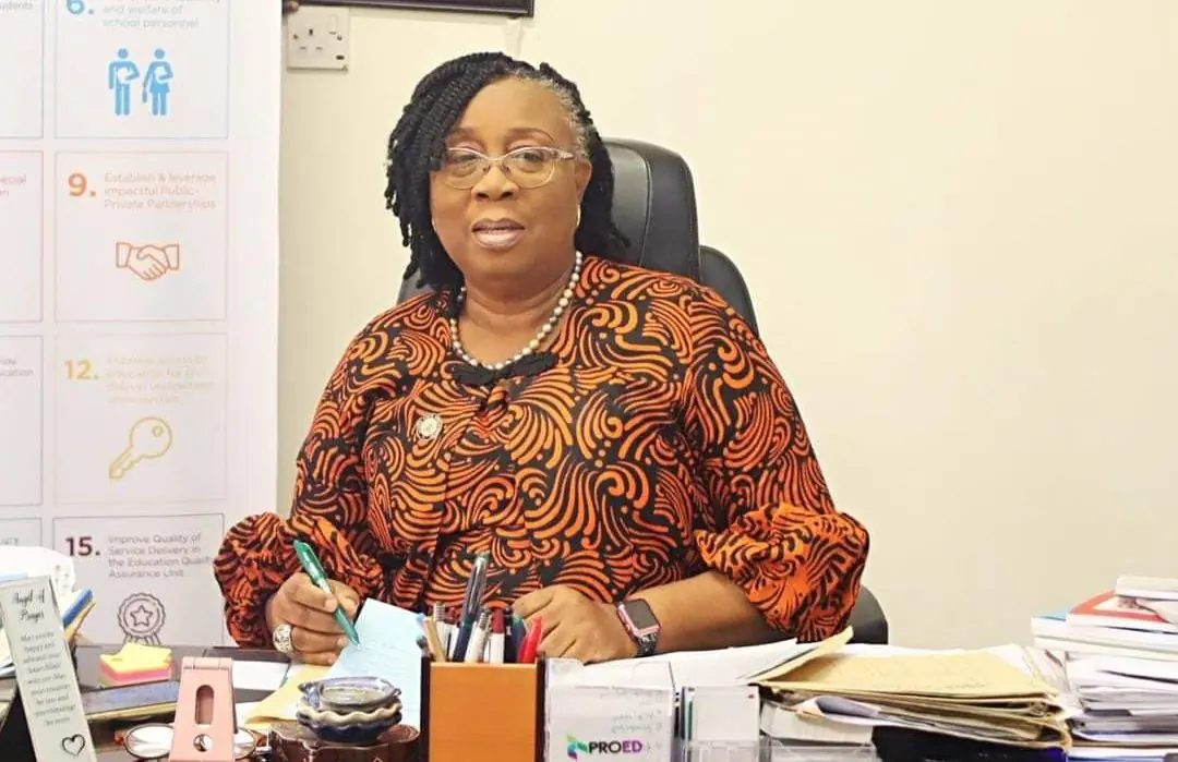 Folasade Adefisayo working at her desk as Commissioner for Education.